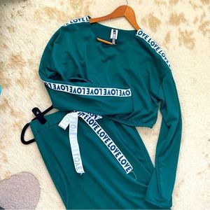 Two piece crop top and a skirt with a high slit.